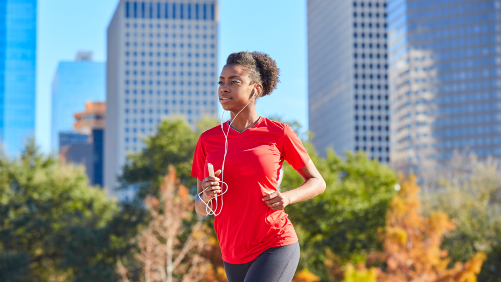 woman jogging while listening to music in Houston